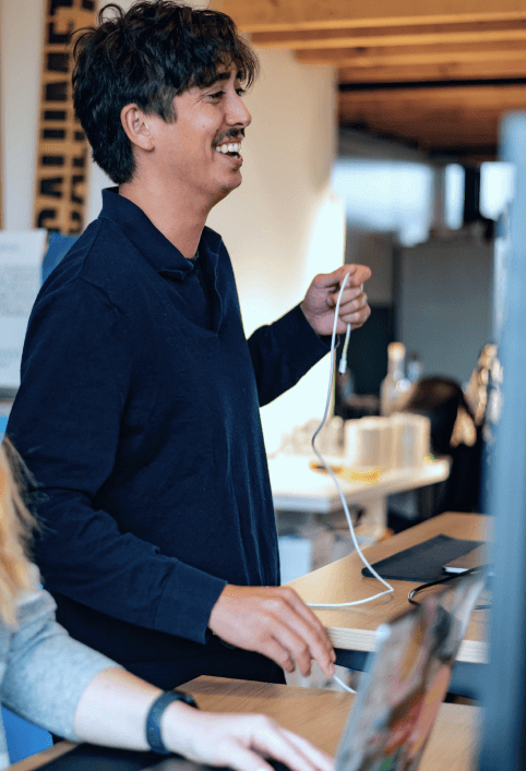 Dale working behind a standing desk.