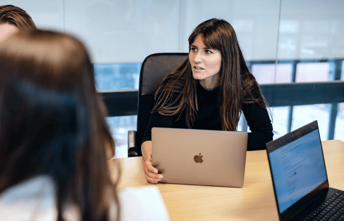 Alicia facilitating a strategy session at the office.